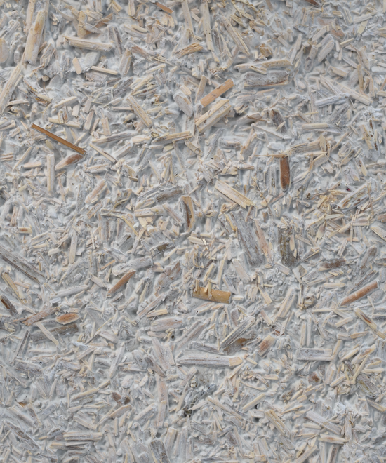 A close-up image revealing the rough texture of an eco mycelium wall covering panel. This panel exemplifies the essence of bio-based and sustainable building materials, reflecting an eco design approach. Its rough texture adds a unique touch to eco friendly interior design while being biodegradable and contributing to sustainability in design. The panel's modular design offers versatility, making it a practical choice for various applications